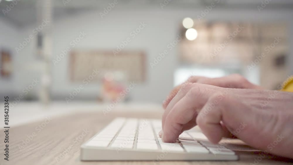 Hands writing on a PC keyboard. Slow motion video