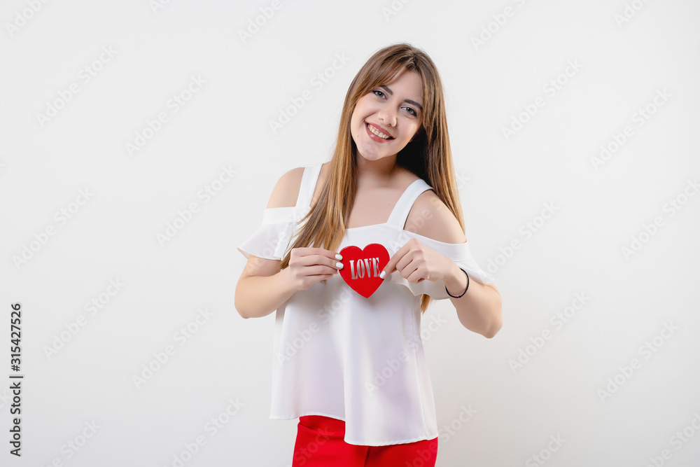 smiling woman with heart shaped figure with love word isolated on white background smiling woman with heart shaped figure with love word isolated on white background