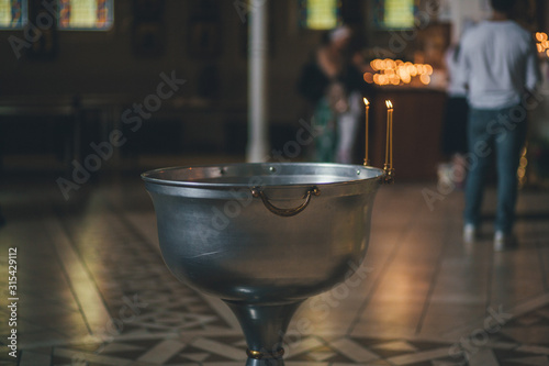 Church ordinance orthodox and wedding, church wedding, religious of a child in church, icons, Orthodox church, candles, interior of the Orthodox Church, bible, font