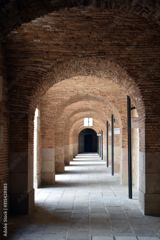 Long Ancient Brick Outdoor Arcade with Weathered Brick Arches & Stone Floor 