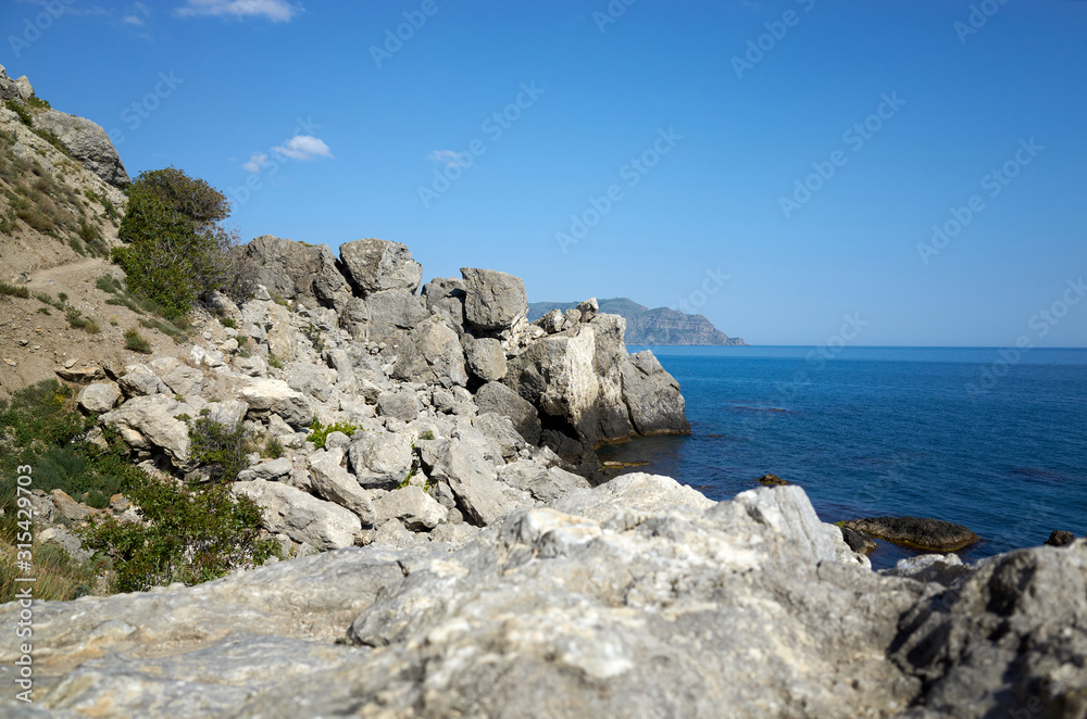 The rocky coast of the Black Sea. Cape Alchak in Sudak, Crimea