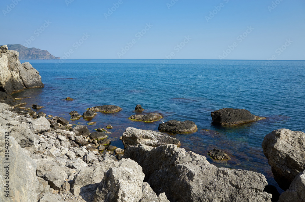 The rocky coast of the Black Sea. Cape Alchak in Sudak, Crimea