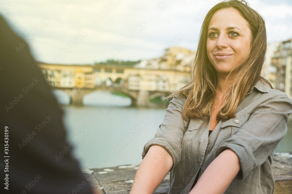Young Couple In Front of Ponte Vecchio. Florence Young Couple In Front of Ponte Vecchio. Florence