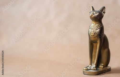 egypt cat statuette on solid background