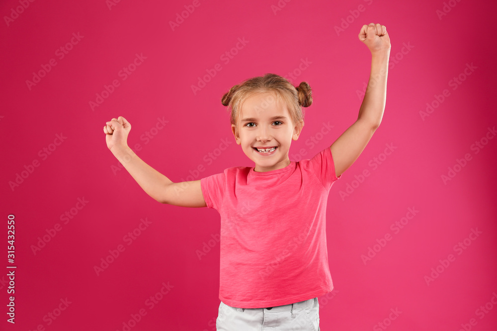 Cute little girl posing on pink background Cute little girl posing on pink background