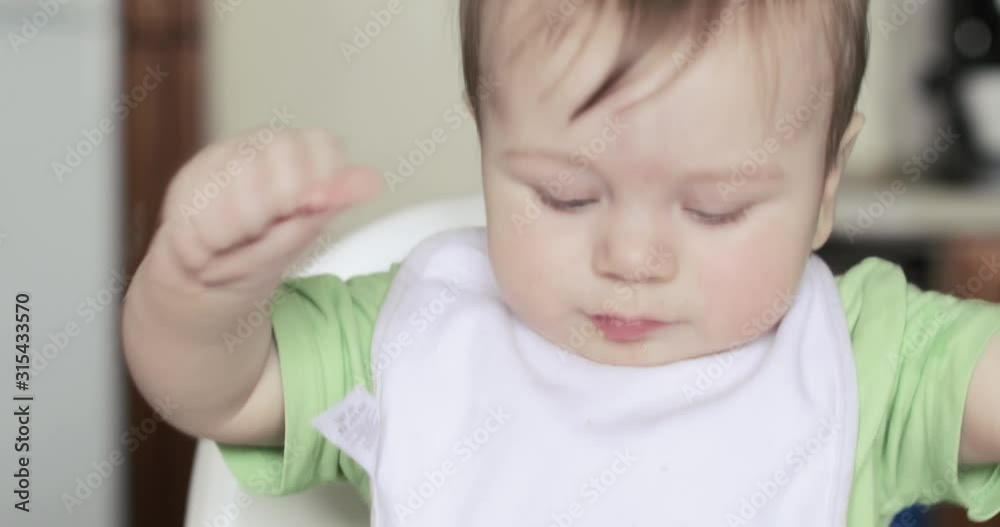 Baby boy eating a cookie Baby boy eating a cookie