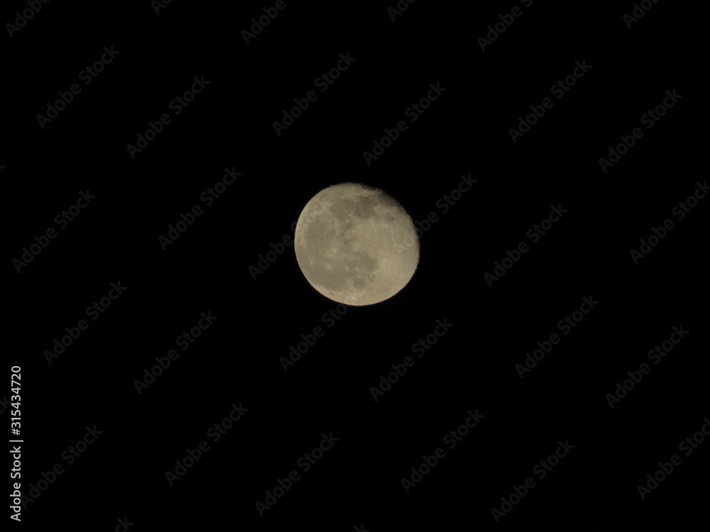 Moon With Clouds In The Night Sky. Concept of a spooky theme and mystery. Moon With Clouds In The Night Sky. Concept of a spooky theme and mystery.