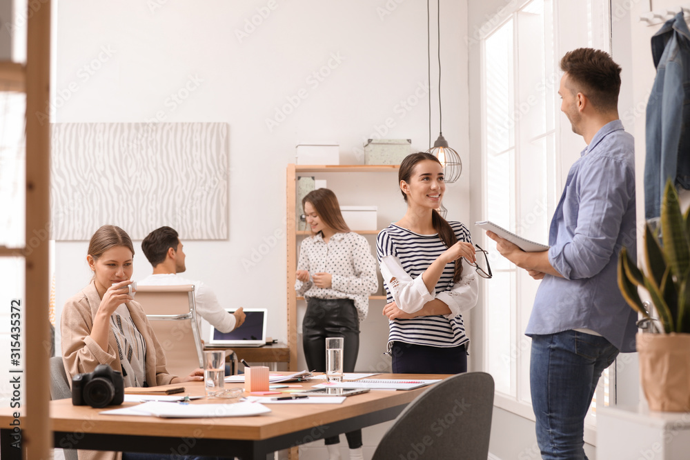 Team of professional journalists working in office Team of professional journalists working in office