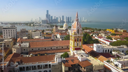 Cartagena Colombia Old Town - Aerial Drone View of the famous Cathedral of Santa Catalina de Alejandria in the Historical City Center of Cartagena de Indias with the Skyscraper Skyline of Bocagrande.
