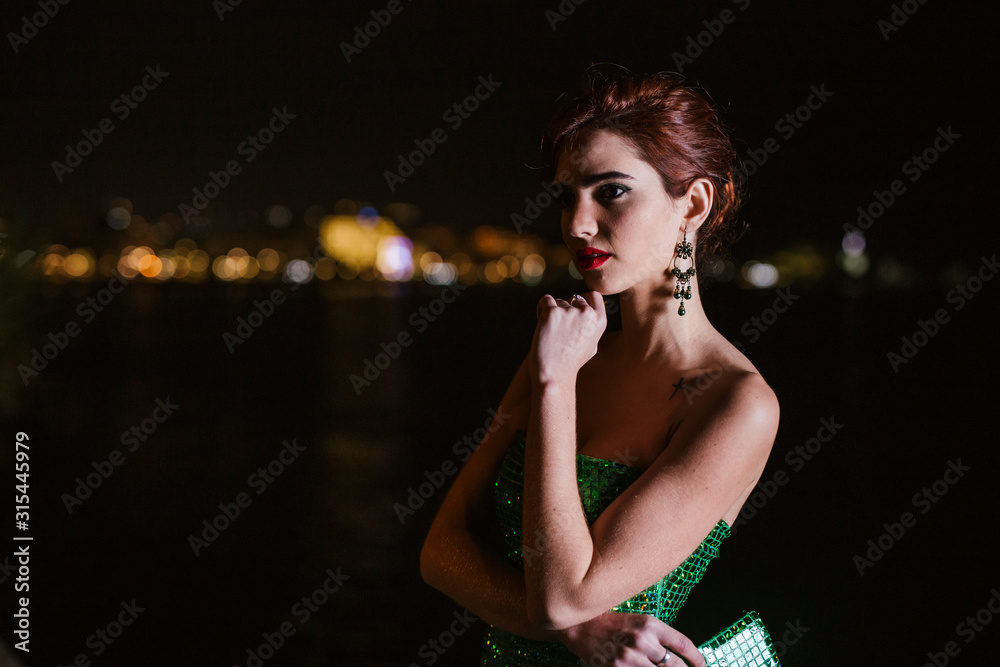 young girl posing with her car and have a nice green dress young girl posing with her car and have a nice green dress