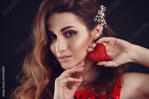 Beautiful arab or latin american woman in red dress