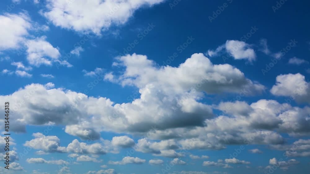 Time lapse clip of white fluffy clouds over blue sky. Time lapse clip of white fluffy clouds over blue sky.