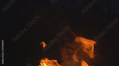 Slow motion fire concept, Fire flame close up  burning super Slow motion.It real fire flame on campfire is rapid oxidation material in exothermic chemical process of combustion releasing heat light