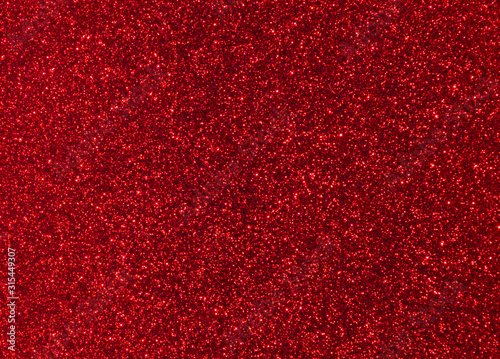 Bright trendy red background with glitter.
