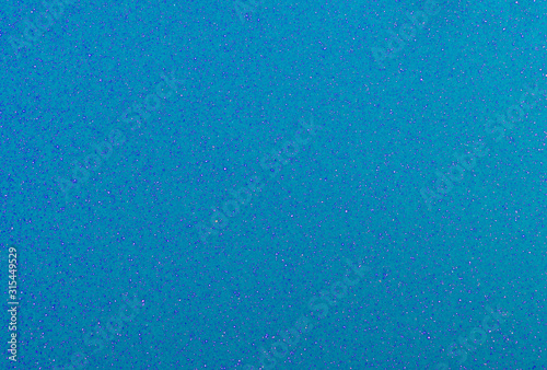 Bright trendy light blue background with glitter.