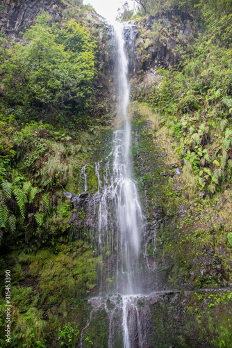 Caldeirao Verde waterfall at the end of the hiking trail on the Levada Caldeirao Verde near Santana on the island of Madeira, Portugal.