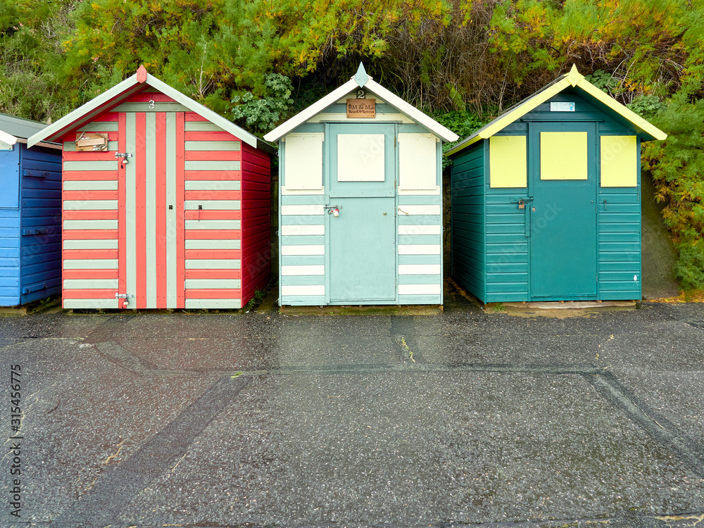 Three stripe beach huts in primary colours on Lowestoft sea front. Three stripe beach huts in primary colours on Lowestoft sea front.