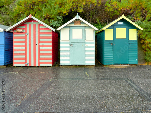 Three stripe beach huts in primary colours on Lowestoft sea front. © Jonathan Fussell