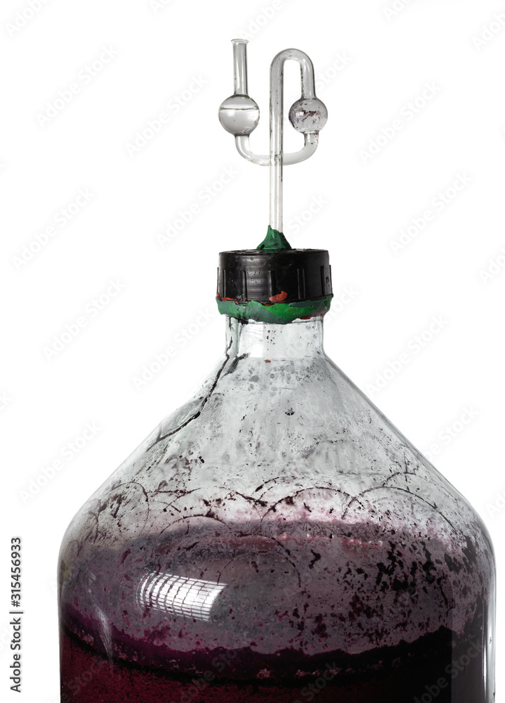 Foto de The process of making red homemade wine. A 20 liter glass