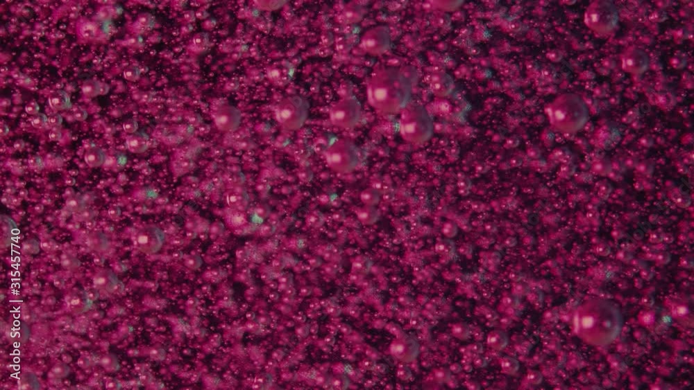 Small Transparent Bubbles go up under liquid on violet background. Abstraction. Small Transparent Bubbles go up under liquid on violet background. Abstraction.