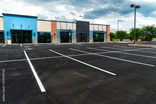 No Customers and Empty Parking Lot at Retail Shopping Center