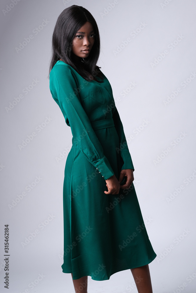 Beautiful face of african-american model on photoshoot. Model wearing a bottle green color and lots fabulous. Beautiful face of african-american model on photoshoot. Model wearing a bottle green color and lots fabulous.