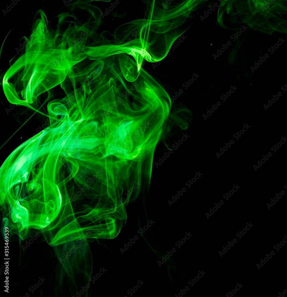 Green smoke on black background Green smoke on black background
