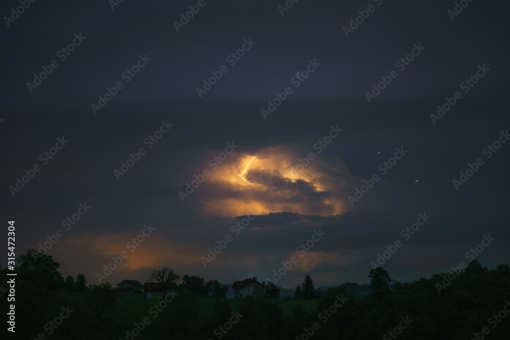 Fototapeta premium Storm cloud on night sky