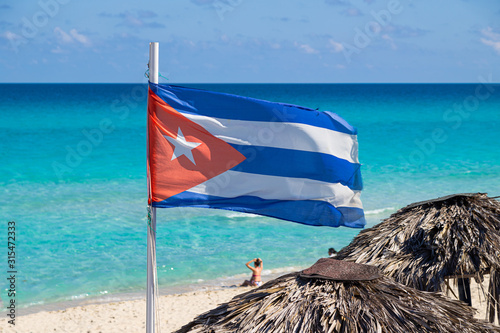 Photography Cuba flag on a background of the sea