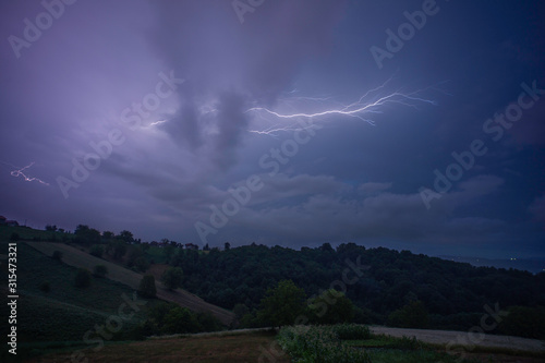 Thunder lightning over cloudy sky