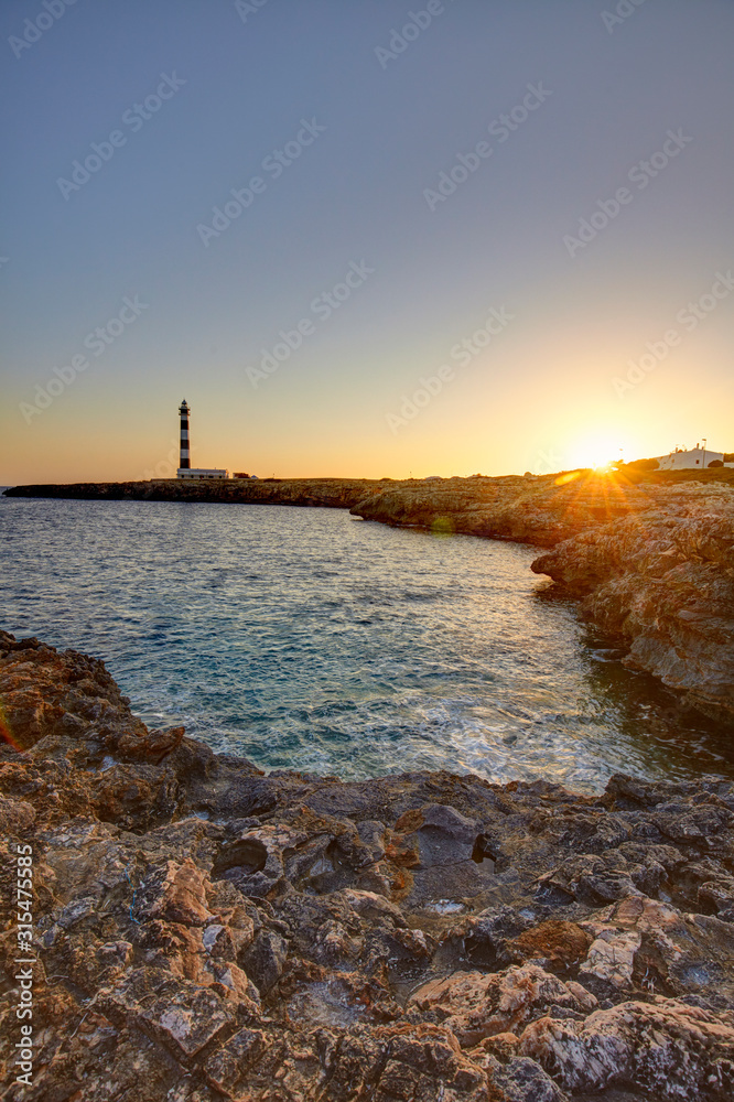 Cap d'Artrutx Lighthouse, located in the extreme south-western point of the island adjacent to the larger resort of Cala en Bosch, Menorca,Balearic Islands, Spain