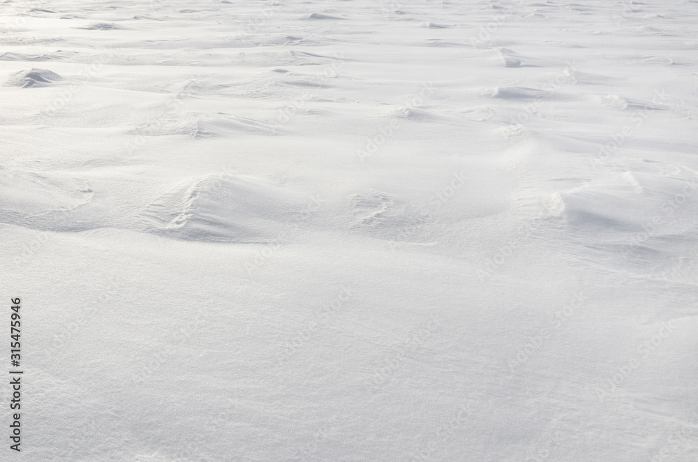 Patterns on a fresh snow texture on a field Patterns on a fresh snow texture on a field