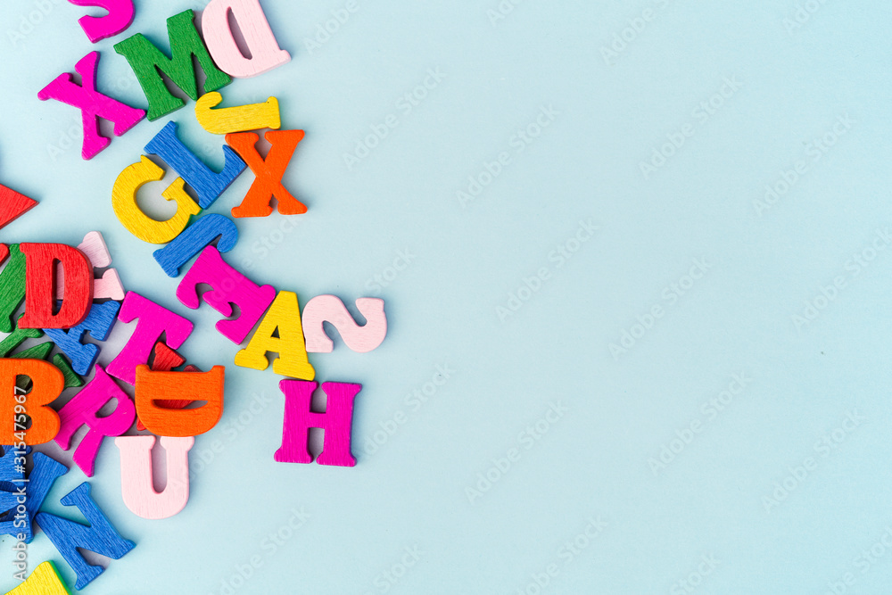 Multicolored letters on a blue background Multicolored letters on a blue background