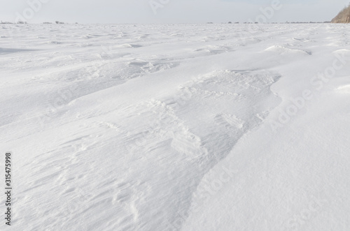 Patterns on a fresh snow texture on a field © Aron M  - Austria