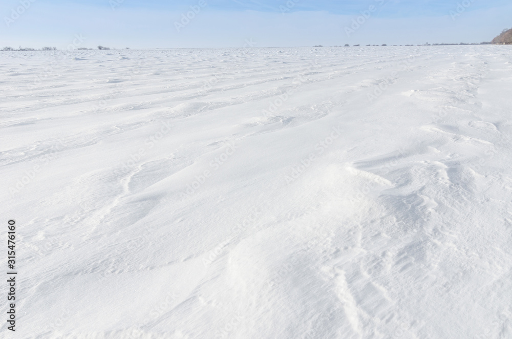 Patterns on a fresh snow texture on a field