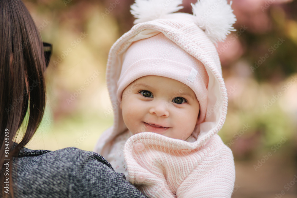 Portrait of cute little baby girl outside with mom. Beautiful girl smile. Five month baby. Happy family Portrait of cute little baby girl outside with mom. Beautiful girl smile. Five month baby. Happy family