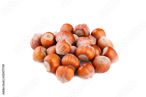 Raw hazelnuts isolated on a white background