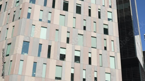 marble facade of a business center building. camera moves slowly along the wall