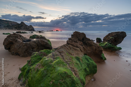 Praia do amado beach at sunset in Costa Vicentina, Portugal