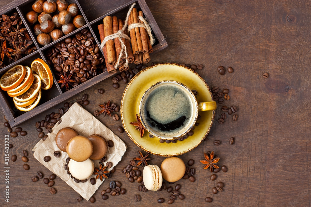 Coffee, chocolate and vanilla macarons on dark background Coffee, chocolate and vanilla macarons on dark background
