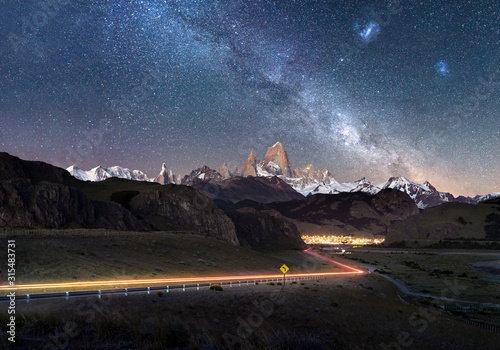 Beautiful light trails towards remote town El Chalten - Fitz Roy Mountain visible under Milky Way photo