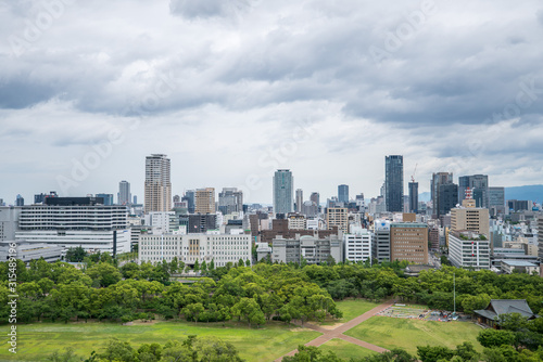 Cityscapes of the skyline in Osaka, with garden park in foreground