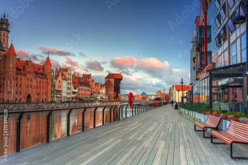 Beautiful scenery of the old town in Gdansk over Motlawa river at sunrise, Poland.