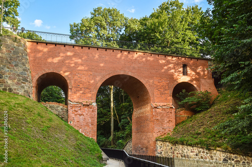 A 14th-century Gothic bridge over the Sajna River in Reszel, Warmian-Masurian Voivodeship, Poland.