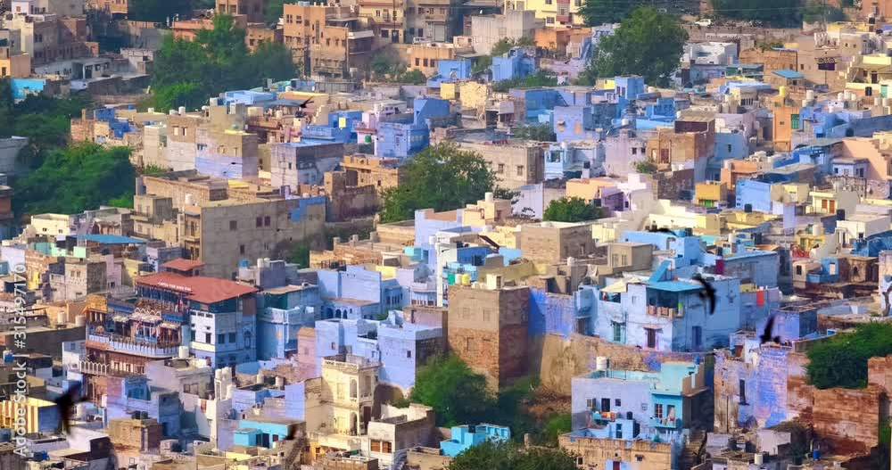 Houses of famous Jodhpur the Blue City, view from Mehrangarh Fort, Rajasthan, India. Camera zoom out Houses of famous Jodhpur the Blue City, view from Mehrangarh Fort, Rajasthan, India. Camera zoom out
