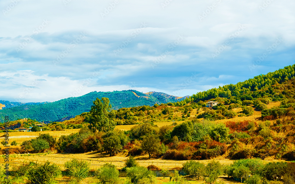 Rural landscape with hills and highland in Posada, Nuoro. Panorama in Sardinia island of Italy. Scenery of Sardegna in summer. Olbia province. Mixed media.