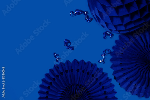 paper fans and honeycombs on the classic dark blue background