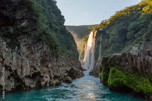 River and amazing crystalline blue water of Tamul waterfall in San Luis Potosí, Mexico