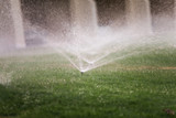 Automatic watering of lawns. Landscape. Mechanized water supply to vegetation. Lawn and garden care.