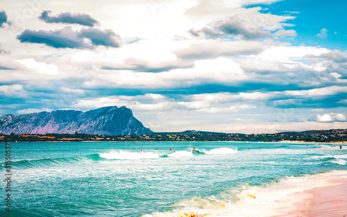 Landscape with La Cinta beach and Mediterranean Sea and Tavolara Island in Sardinia on Italy in summer. Scenery view on Sardinian beach in Sardegna. Olbia province. Mixed media.